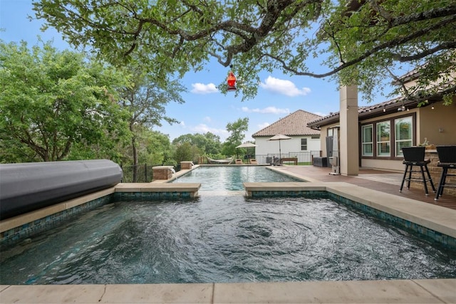 view of pool with an outdoor hot tub and a patio area