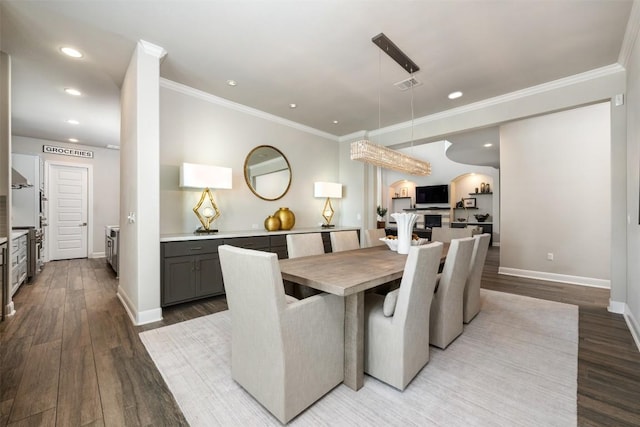 dining area featuring light hardwood / wood-style flooring and ornamental molding