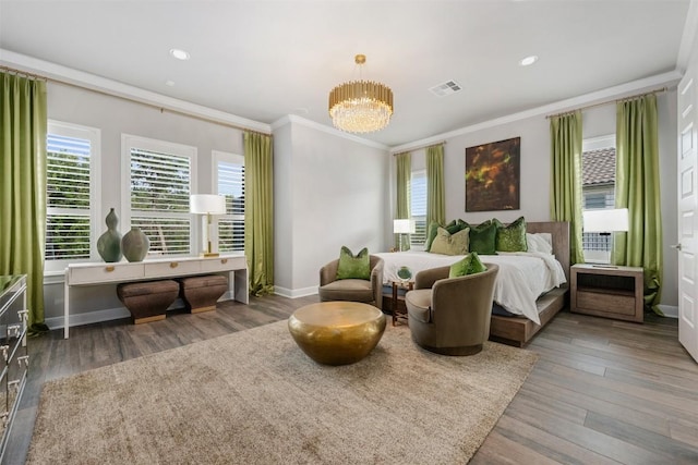 bedroom featuring dark wood-type flooring, a notable chandelier, and ornamental molding