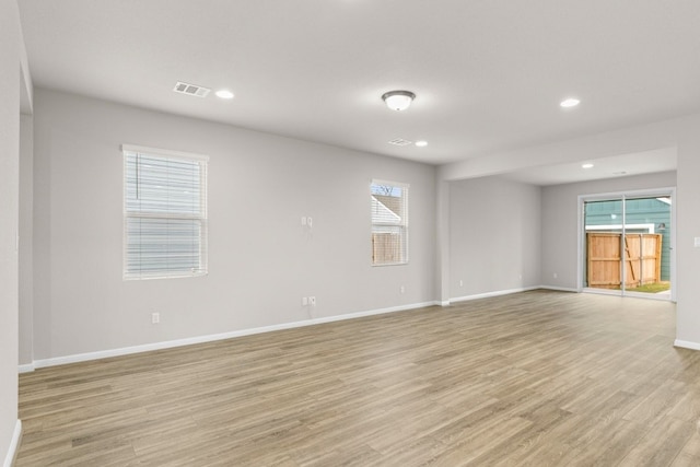 unfurnished room featuring light hardwood / wood-style floors