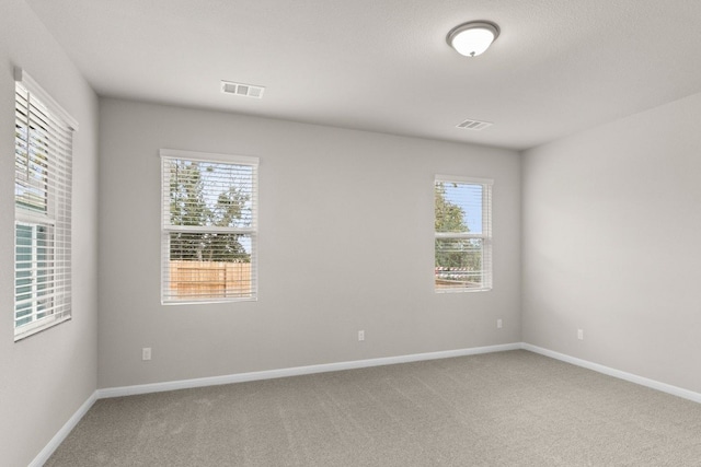 empty room featuring carpet flooring