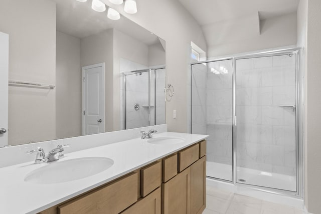 bathroom with vanity and a shower with shower door