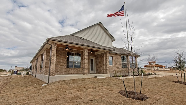 back of property featuring ceiling fan