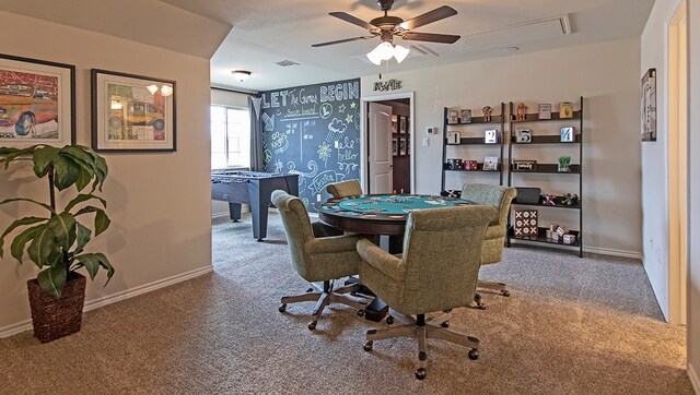 interior space with ceiling fan