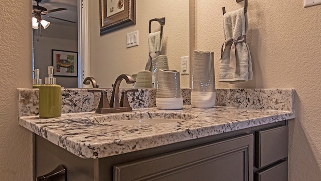 bathroom featuring vanity and ceiling fan