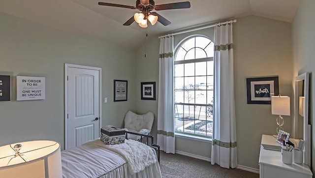 bedroom featuring ceiling fan, vaulted ceiling, and carpet flooring