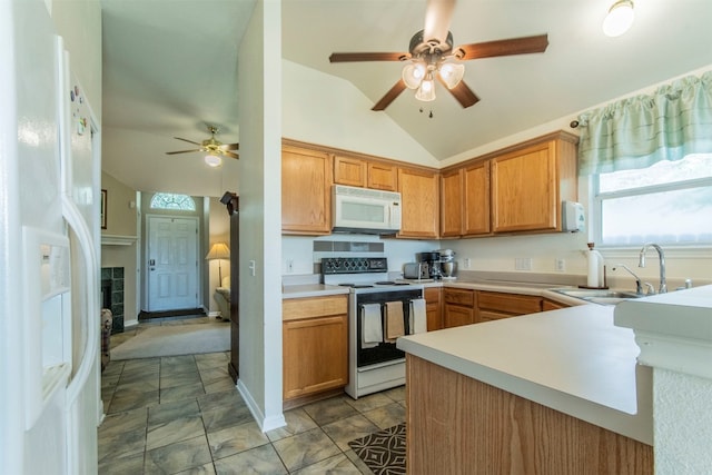 kitchen with ceiling fan, white appliances, light tile floors, sink, and lofted ceiling