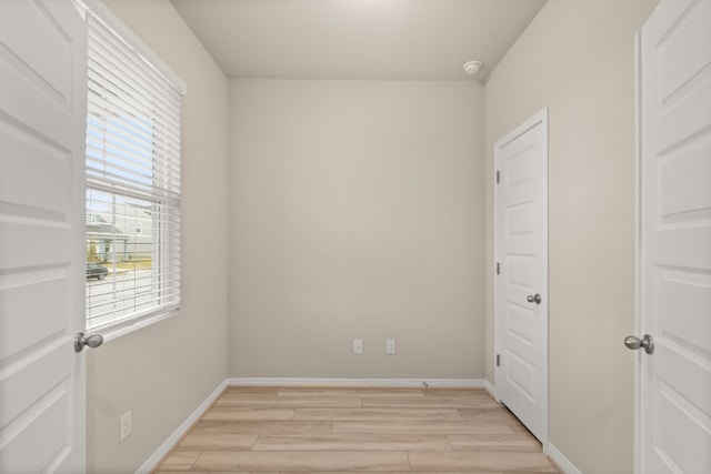 empty room with light hardwood / wood-style floors