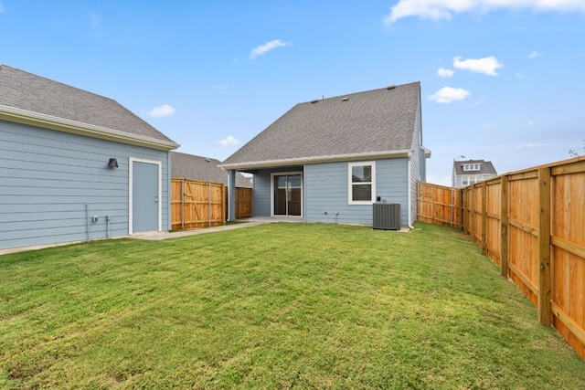 back of property featuring a yard and cooling unit