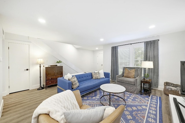 living room with light hardwood / wood-style flooring