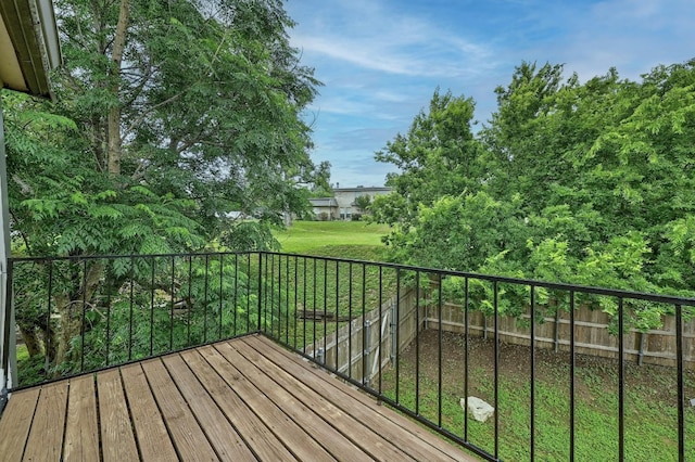 wooden terrace with a lawn