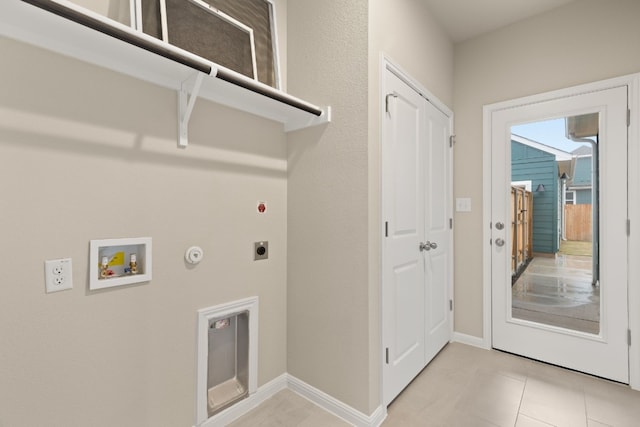 clothes washing area featuring gas dryer hookup, washer hookup, and electric dryer hookup