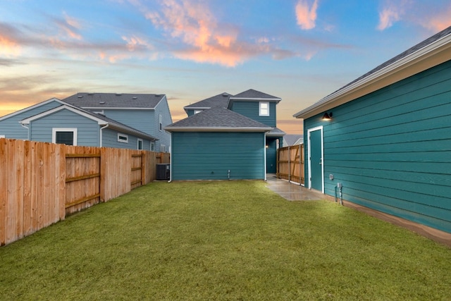 yard at dusk with central AC