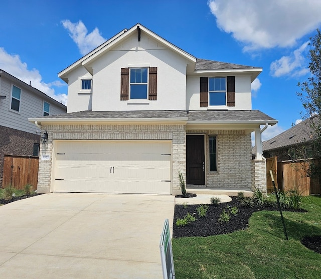 view of front facade with a front yard and a garage