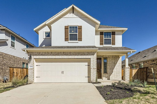 view of front of property featuring fence, driveway, an attached garage, stucco siding, and brick siding