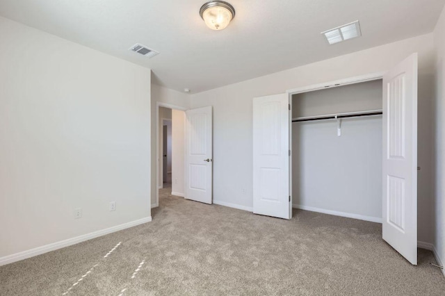 unfurnished bedroom with visible vents, baseboards, and carpet