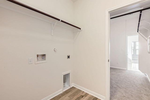 laundry room with baseboards, washer hookup, laundry area, hookup for a gas dryer, and hookup for an electric dryer