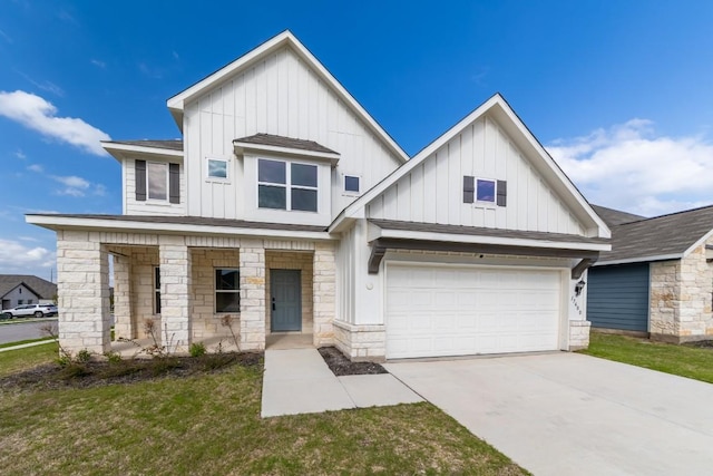 view of front of house with a garage and a front lawn