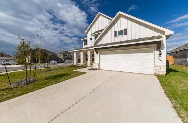 view of front of home featuring a garage and a front yard