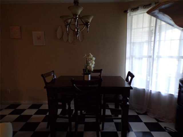 dining room with a notable chandelier