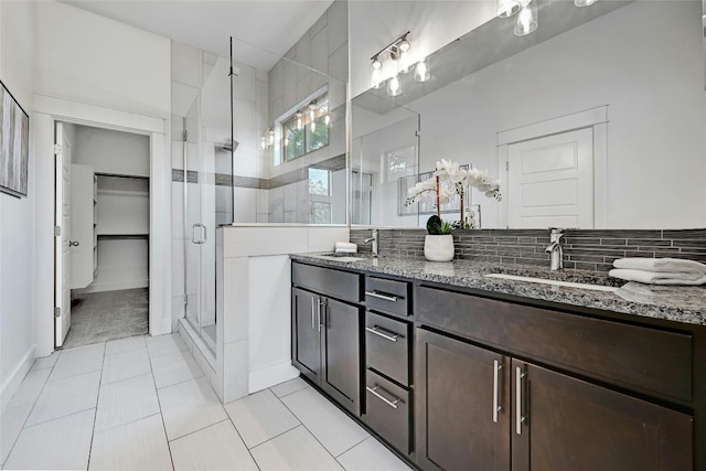 bathroom with tile patterned flooring, vanity, and an enclosed shower