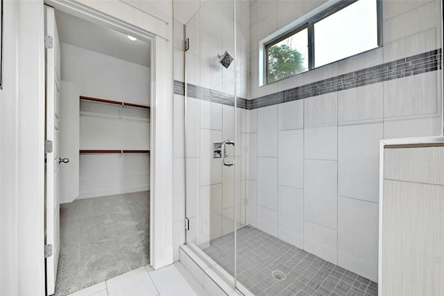 bathroom with tile patterned flooring and an enclosed shower