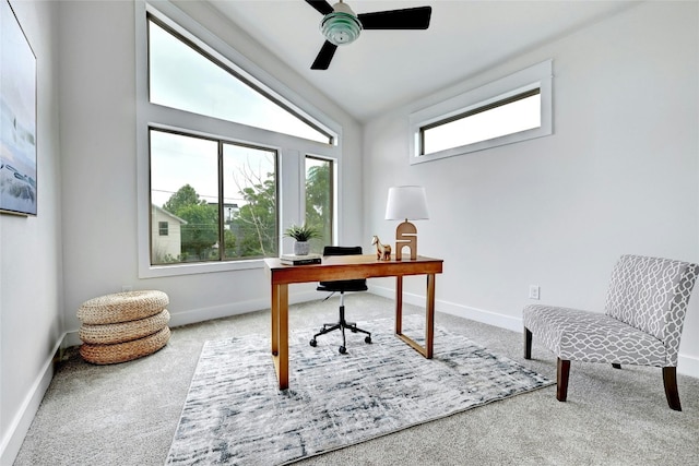 home office featuring ceiling fan, carpet, and vaulted ceiling