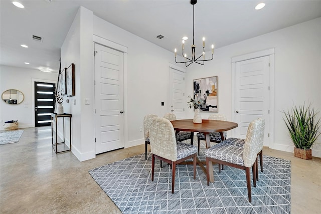 dining area featuring an inviting chandelier