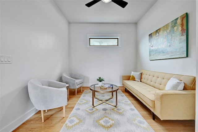 living room with hardwood / wood-style floors and ceiling fan