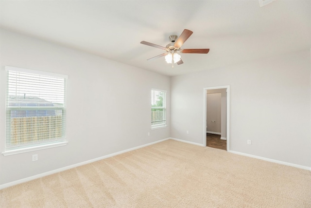 carpeted empty room with ceiling fan