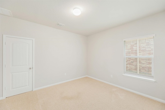 unfurnished room with carpet flooring and a healthy amount of sunlight