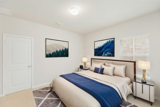 bedroom featuring light colored carpet