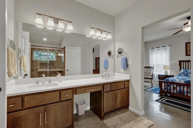 bathroom featuring tiled shower, a sink, and plenty of natural light