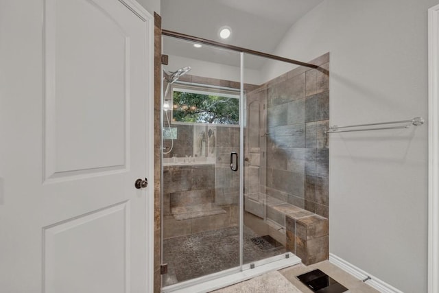 full bath featuring baseboards and a stall shower