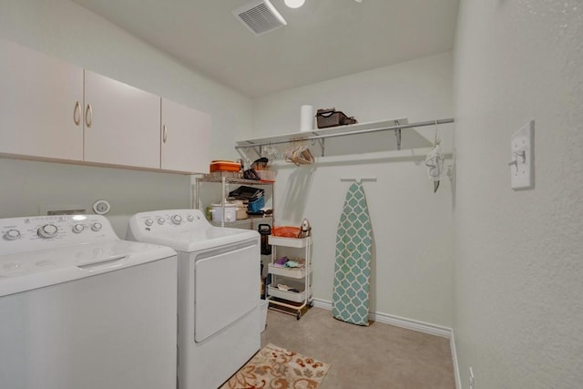washroom featuring cabinet space, visible vents, independent washer and dryer, and baseboards