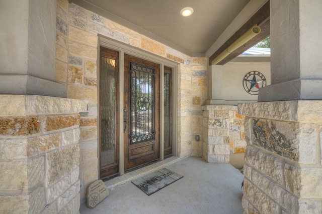 property entrance with stone siding