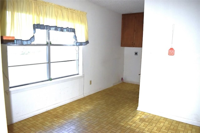 spare room featuring plenty of natural light