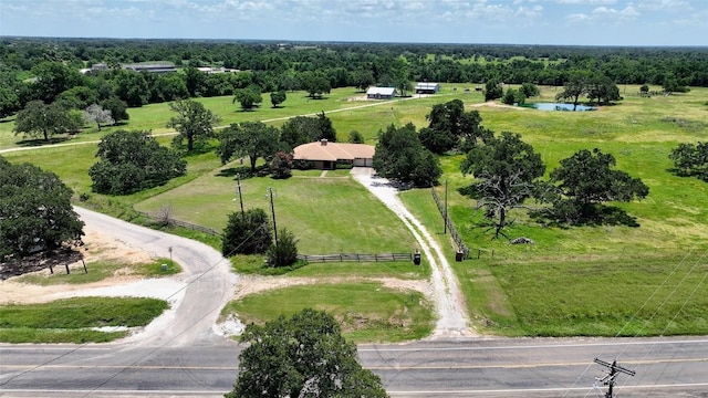 birds eye view of property with a rural view