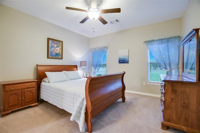 bedroom with light colored carpet and ceiling fan