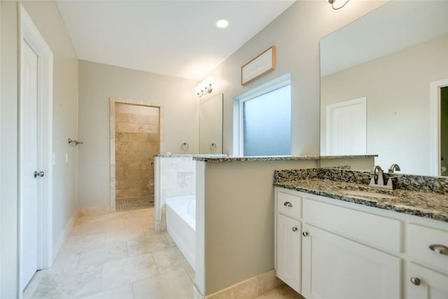 bathroom featuring vanity and shower with separate bathtub