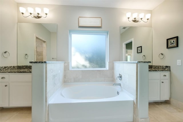 1502 Hi Cir S, Horseshoe Bay, TX 78657 - bathroom featuring tile patterned floors, a garden tub, vanity, and a chandelier