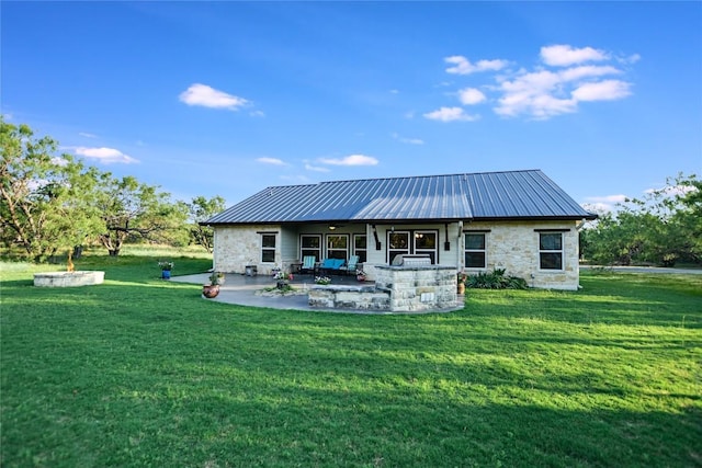 1502 Hi Cir S, Horseshoe Bay, TX 78657 - rear view of property with a ceiling fan, a patio area, stone siding, a lawn, and metal roof