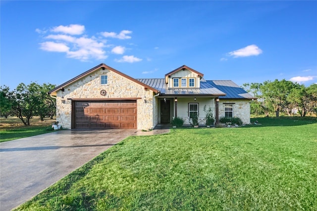 view of front of house featuring a front yard and a garage