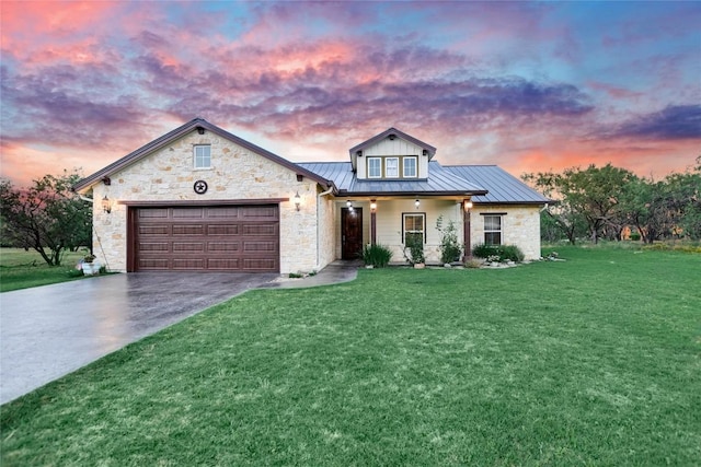 1502 Hi Cir S, Horseshoe Bay, TX 78657 - view of front facade featuring a standing seam roof, driveway, a front yard, a garage, and stone siding
