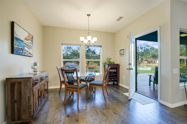 1502 Hi Cir S, Horseshoe Bay, TX 78657 - dining area featuring dark wood-style flooring, a chandelier, and baseboards