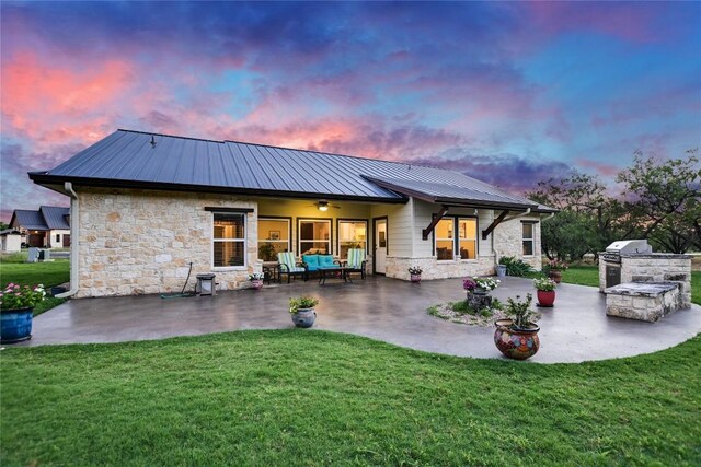 1502 Hi Cir S, Horseshoe Bay, TX 78657 - back of property featuring a patio, stone siding, and a yard