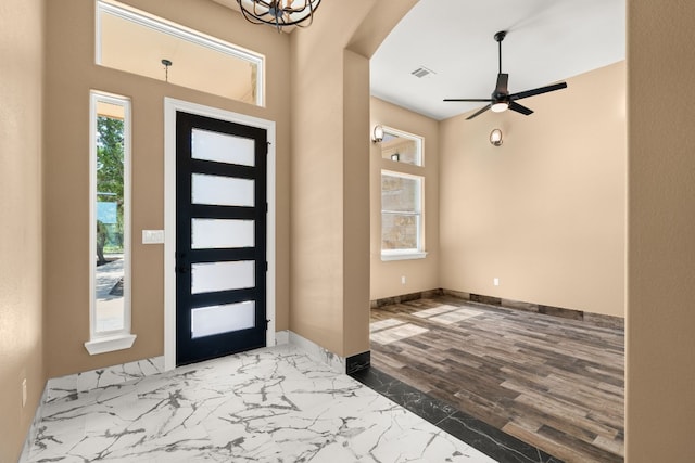 foyer featuring hardwood / wood-style flooring and ceiling fan