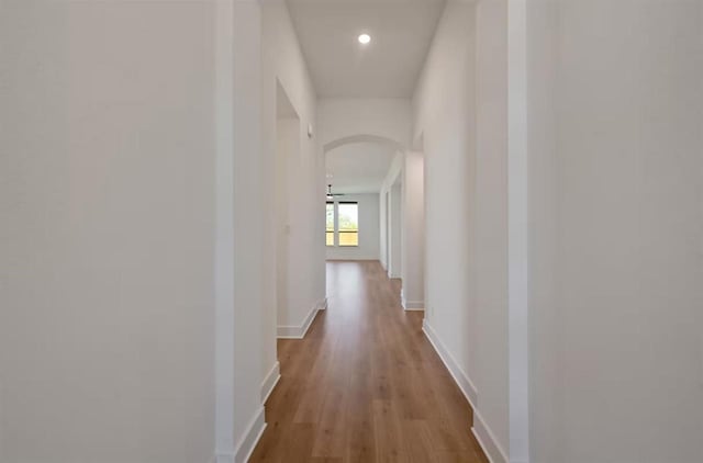 corridor with light wood-type flooring