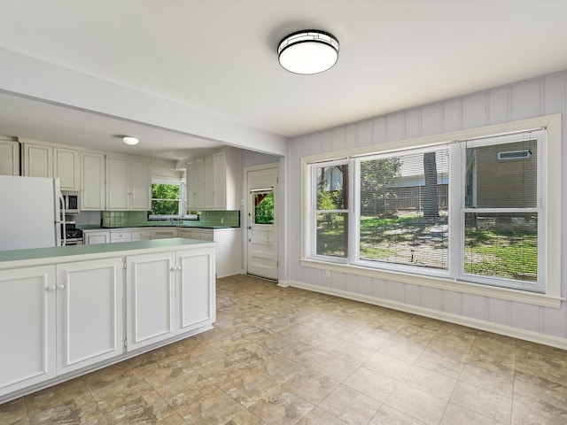 kitchen with white cabinetry and appliances with stainless steel finishes