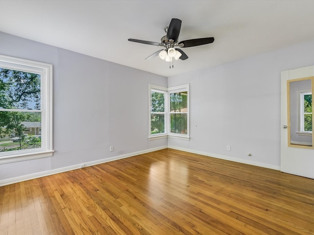 empty room featuring light hardwood / wood-style flooring and ceiling fan